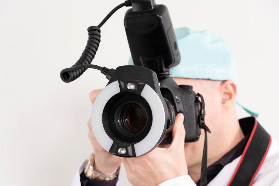 Dentist utilizing advanced dental photography techniques for improved patient care